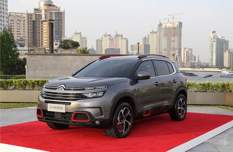 Carlos Tavares hopes the Citroen C5 Aircross, pictured against the backdrop of Shanghai, will help revive PSA's sales in China.