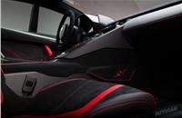 The stripped-out interior features new woven carbonfibre fabric trim