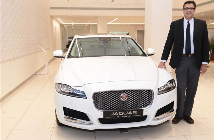 Rohit Suri, MD and president, Jaguar Land Rover India, with the locally manufactured XF sedan.
