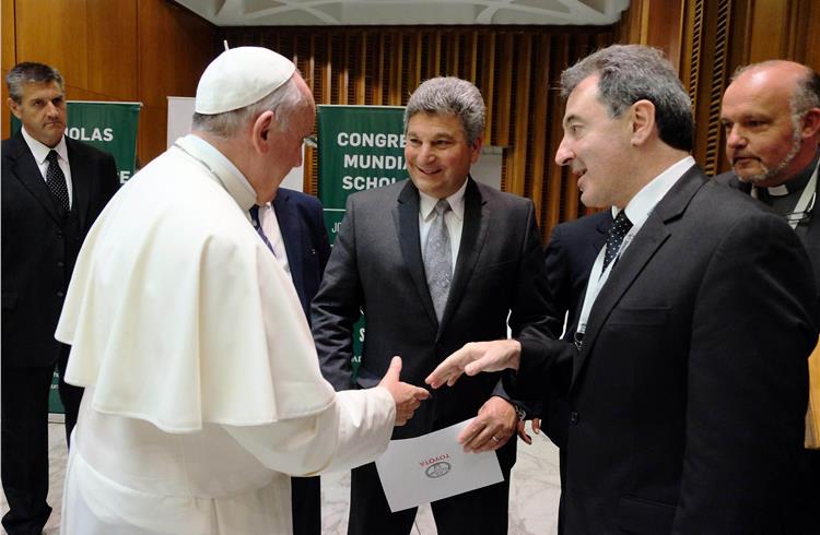 Pope Francis, Toyota Motor Corporation Regional CEO for Latin America and the Caribbean Steve St. Angelo, and president of Toyota Argentina Daniel Herrero.
