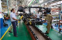 Front axle with suspension getting ready to be mounted on a vehicle. Ashok Leyland produces front axles in-house with its own technology and processes.