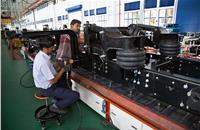 A typical Ashok Leyland M&HCV consists of between 300-400 parts sourced from vendors across the country. Lift axle assembly in progress on a chassis.