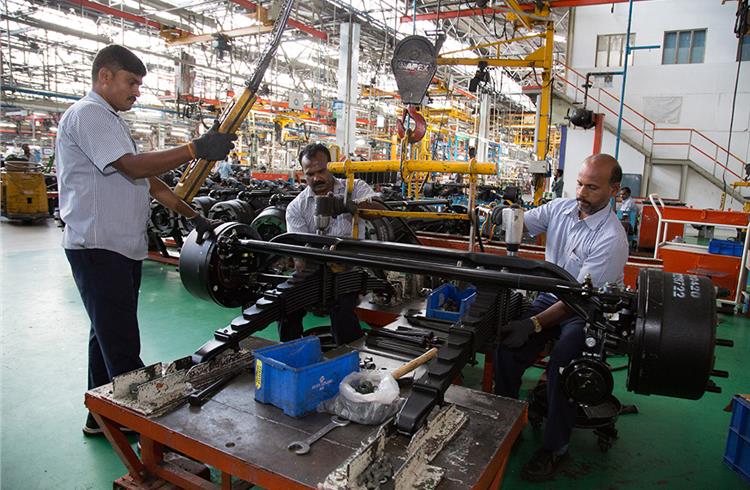 Front axle assembled with springs at a sub-assembly station. There are 25 stations on the assembly line with each station taking 10 minutes.