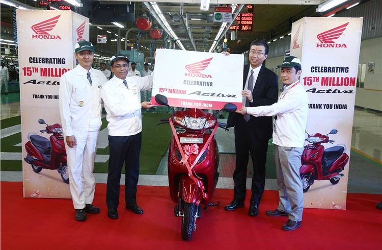 Minoru Kato, president & CEO, HMSI (second from right), with the 15 millionth Activa at HMSI's scooter-only plant in Ahmedabad, Gujarat.