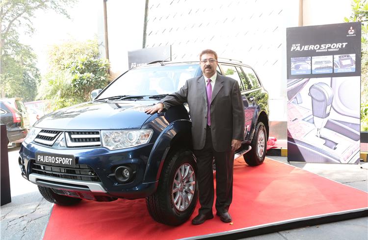 HMFCL'sMD Uttam Bose with the newly launched automatic variant of the Pajero Sport