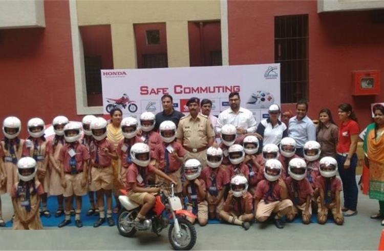 Honda in association with Reliance General Insaurance distributed helmets to school kids at its road safety campaign