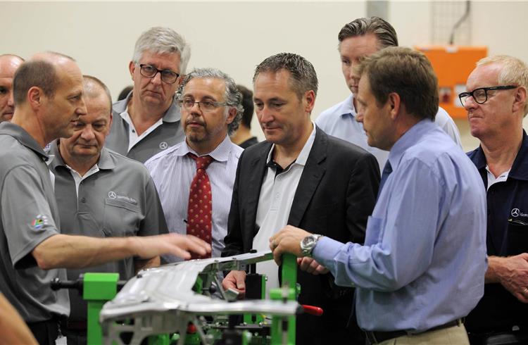 On-site quality check: Dr. Klaus Zehender, Divisional Board Member Procurement and Supplier Quality Mercedes-Benz Cars (4th right), visiting a locally established supplier in South Africa.