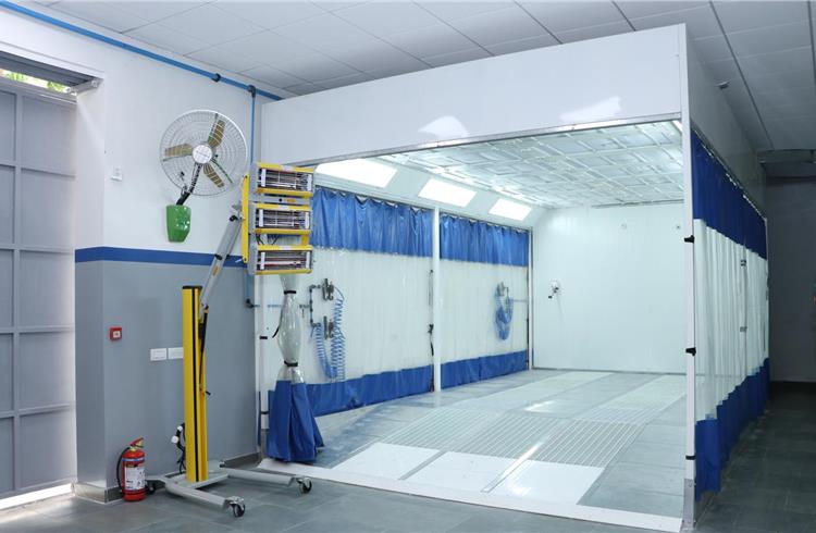 Paint booth for top coat and clear coat application, allowing for superior and crisp end result.