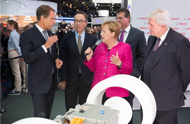 Bosch-CEO Dr. Volkmar Denner welcomes chancellor Angela Merkel at the Bosch booth at IAA 2017.