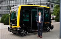 Continental CEO Dr. Elmar Degenhart and Continental’s CUbE robo-taxi.