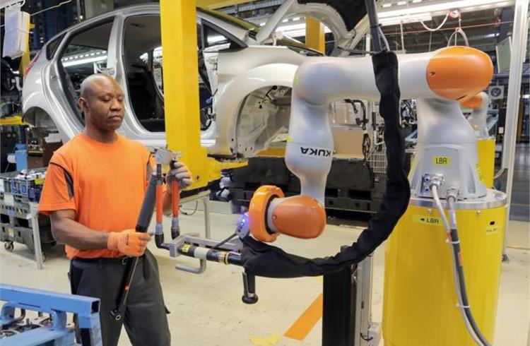 Industry 4.0 at work as car workers buddy up with robots