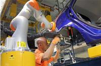 Industry 4.0 at work as car workers buddy up with robots