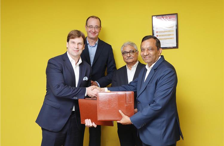 L-R: Jim Farley, Ford executive VP and president of Global Markets, and Peter Fleet, Group VP and president, Ford Asia Pacific, with Rajan Wadhera, president, automotive sector and Dr Pawan Goenka, ma