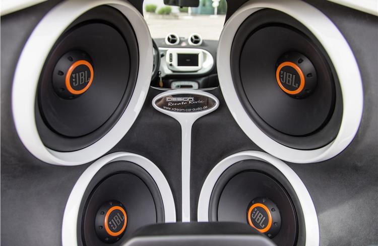Fitted into custom-made plates, a top-of-the-line JBL sound system is integrated.