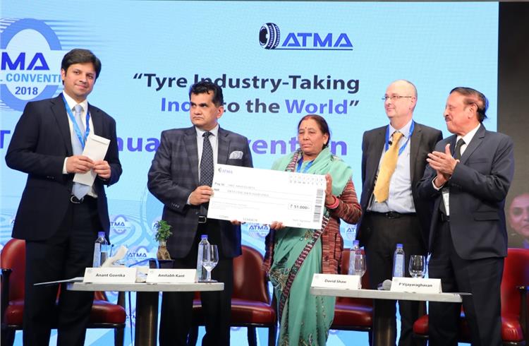 Shanti Devi, India's only known lady truck tyre mechanic being honoured at ATMA Convention.