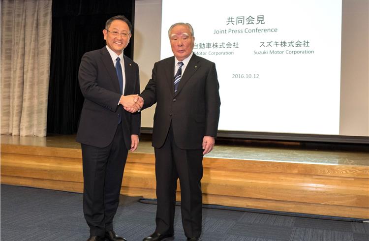 Toyota's president Akio Toyoda and Osamu Suzuki, chairman of Suzuki Motor Corporation at a media meet in Tokyo on October 12.