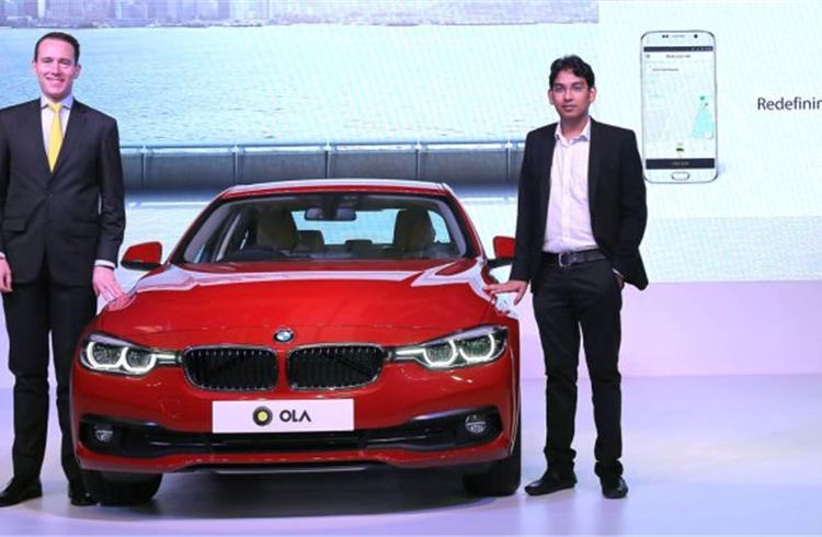 L-R Frank Schloeder, president (act.) BMW India and Pranay Jivrajka, chief operating officer, Ola.