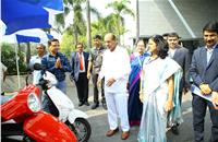 Union minister Anant Geete takes a close look at some of the electric vehicles on display at ITEC India 2017.