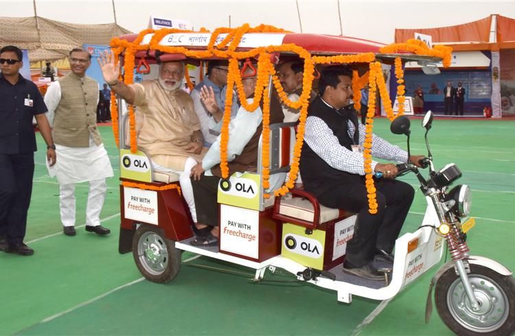 Prime minister Narendra Modi takes a ride on an e-rickshaw at the launch of the 'Stand Up India' initiative in Noida, Uttar Pradesh on April 5 (Photo: PIB).