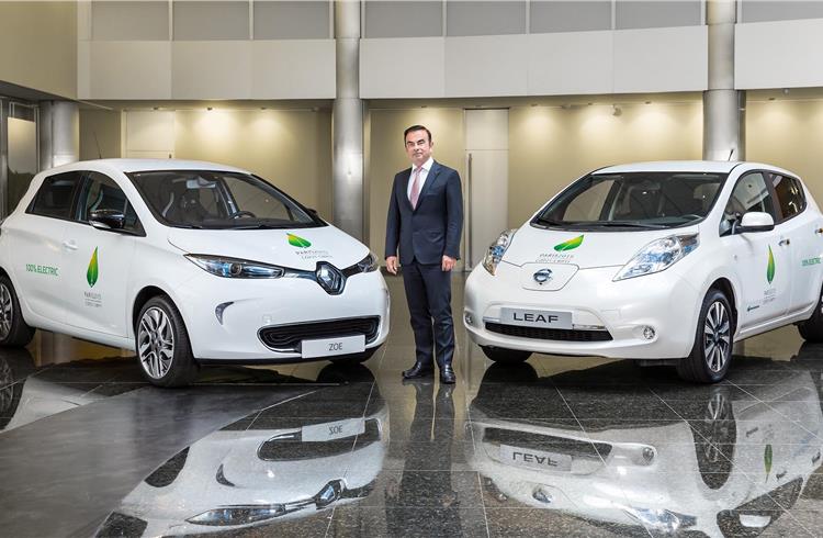 Carlos Ghosn, chairman and CEO of the Renault-Nissan Alliance, with the official COP21 all-electric Renault Zoe and Nissan Leaf.