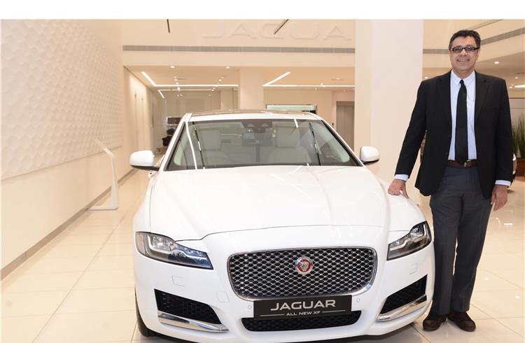 Rohit Suri, MD and president, Jaguar Land Rover India, with the locally manufactured XF.