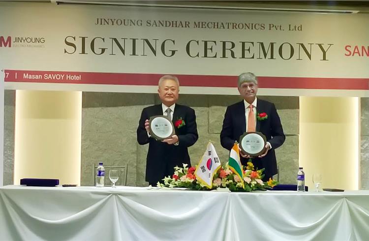 L-R: Doo-Yung Kim, president, Jinyoung Electro-Mechanics, and Jayant Davar, founder, co-chairman and MD of Sandhar Technologies, signed the JV pact on March 22 in Changwon, South Korea.