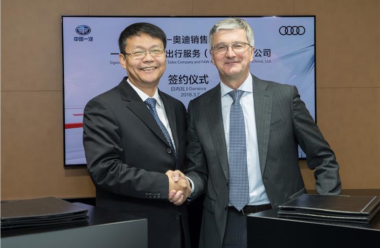 R-L: Rupert Stadler, chairman of the Board of Management of Audi AG, and Qin Huanming, vice-president of the China FAW Group