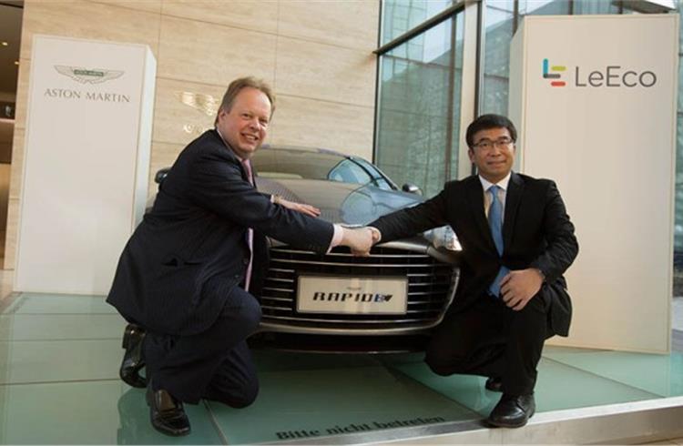 Dr Andy Palmer, CEO, Aston Martin (left) seals the deal with Ding Lei, co-founder and global vice- chairman of SEE Plan.