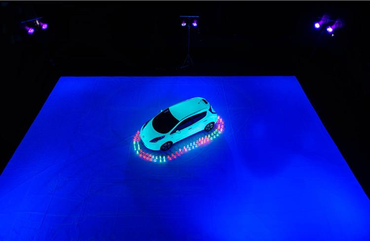 Glow-in-the-dark Leaf helped paint a 207.68 square metre self-portrait of the 100% electric car.