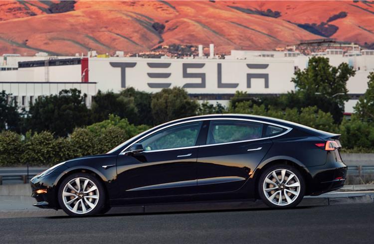 First official picture of the Model 3, which seats five, goes from 0-100kph in less than six seconds and ekes out more than 250 miles/400 kilometres from one charge.