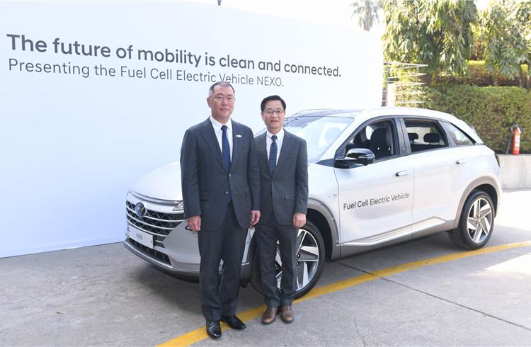 L-R: Chung Eui-sun, vice-chairman, Hyundai Motor Company, with S H Kim, vice-president, Namyang R&D Centre, Hyundai Motor Company, with the Nexo fuel cell electric vehicle at the 2nd India-Korea Busin