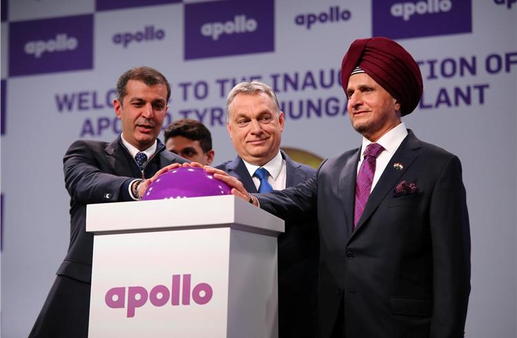 The prime minister of Hungary, Viktor Orban (centre) flanked by Onkar Kanwar, chairman and Neeraj Kanwar, vice-chairman and MD, Apollo Tyres, officially start production at the new plant.