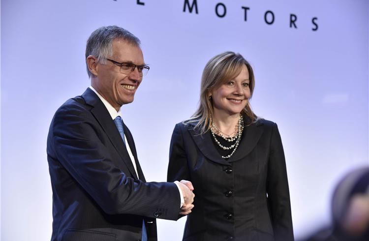 Carlos Tavares, chairman, PSA Group, and Mary T Barra, GM chairman and CEO, seal the deal at a media meet today.