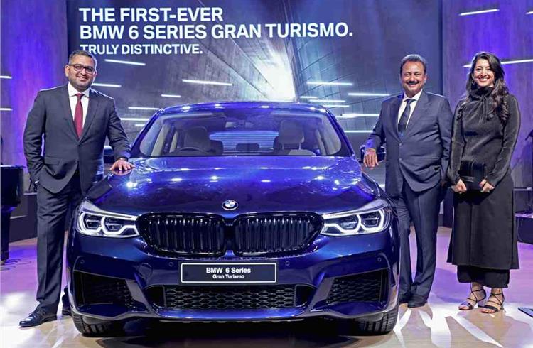 (L-R) Mihir Dayal, Director, Marketing, BMW Group India, Sharad Kachalia, Dealer Principal, Navnit Motors and Pooja Choudary, Dealer Principal, Infinity Cars with the first-ever BMW 6 Series Gran Turi
