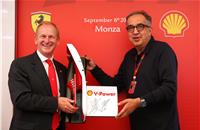 John Abbott, Shell Downstream director accepts a gift from Sergio Marchiomme, CEO of FCA