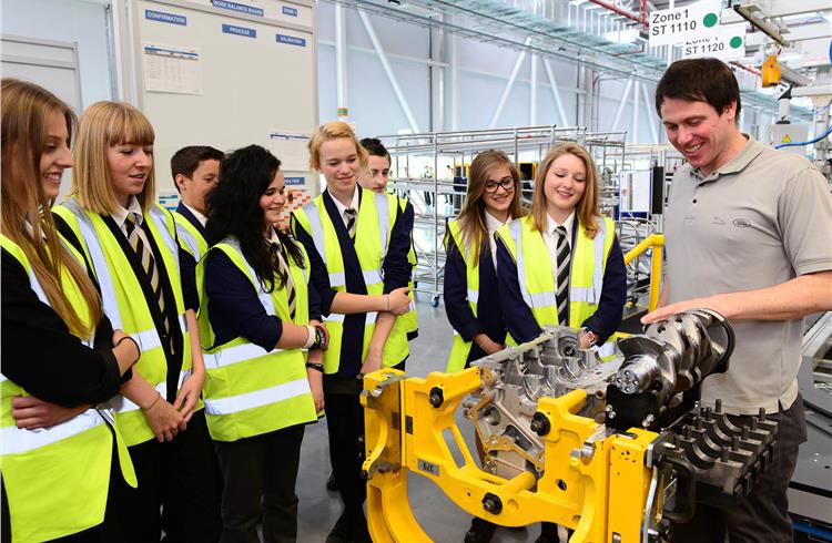 A bunch of young people visiting the Engine Manufacturing Centre to know more about about careers in engineering.