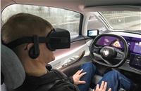 Look, no hands (or eyes): Symbioz drives while Attwood 'experiences' a VR world.