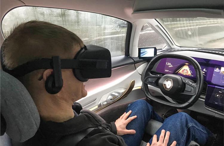 Look, no hands (or eyes): Symbioz drives while Attwood 'experiences' a VR world.