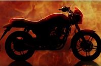 The teaser reveals a silhouette of a sporty motorcycle with a sculpted tank.