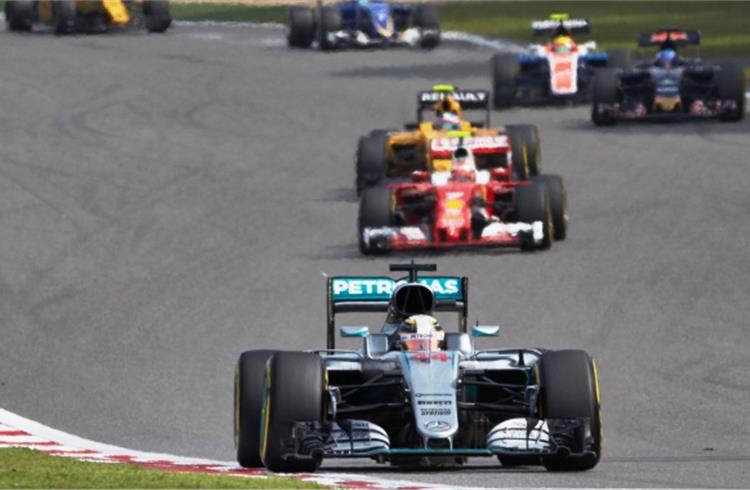 Lewis Hamilton in his Mercedes F1 W07 Hybrid leads Kimi Raikkonen in a Ferrari SF16-H, at the Singapore GP on September 18. Tata Communications has enabled Mercedes AMG Petronas to transfer real- time
