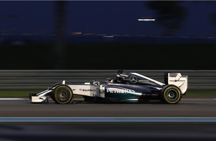 Lewis Hamilton races in his Mercedes F1 W05 Hybrid in the 2014 season at the Yas Marina circuit in Abu Dhabi on November 23.