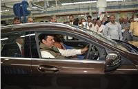 Devendra Fadnavis, chief minister of Maharashtra, drives out the first Made-in-Chakan Mercedes-Benz GLA.