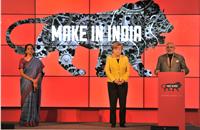 Nirmala Sitharaman, minister of state for commerce & industry, with Narendra Modi and Angela Merkel.