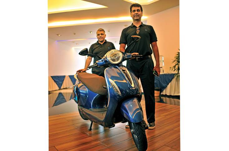 Rajiv Bajaj with electric Chetak scooter
