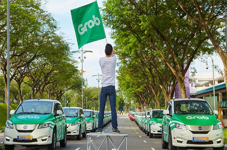 Grab ride sharing fleet backed by Toyota