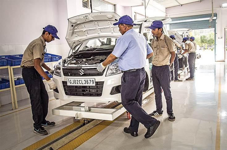 Students acquire skills in vehicle assembly through a first-of-its-kind mini vehicle assembly line at JIM