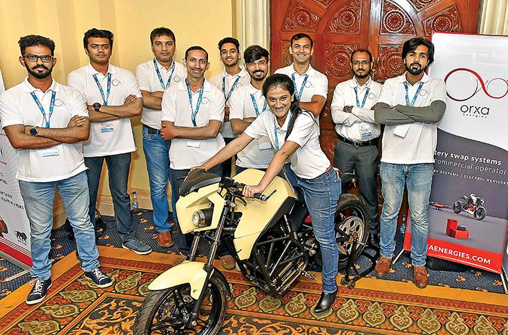 Orxa energy team with the Mantis electric motorcycle