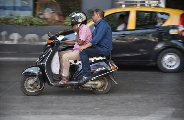 Drunken driving/ consumption of alcohol and drugs, jumping of red light and use of mobile phones (pictured here) together accounted for 6.5% of total accidents and 6.2% of total deaths in 2018.