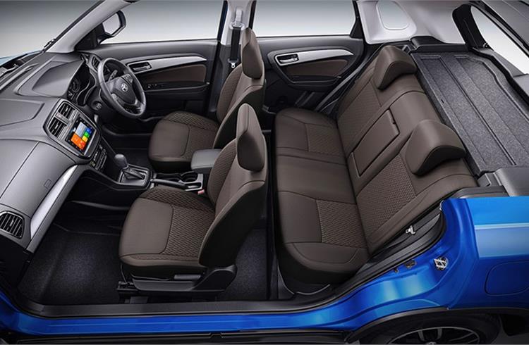 Toyota Urban Cruiser gets dual-tone dark brown interiors inside a spacious cabin.