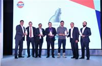Gulf Oil chairman Sanjay Hinduja; CEO and MD Ravi Chawla and brand ambassador MS Dhoni, with the team from Piaggio Vehicles.